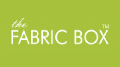 Logo with light green background and white text that reads "the FABRIC BOX™" in a modern, clean font—ideal for a Blind Shop offering Made to Measure Blinds.